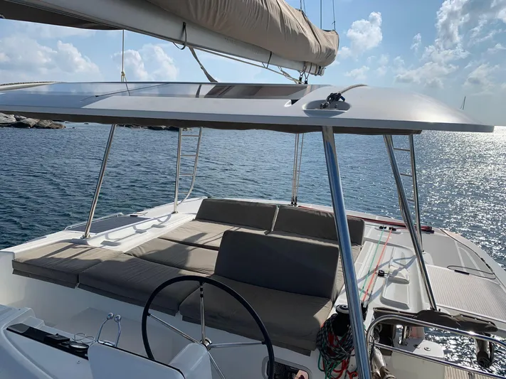Martina Yacht Photos Pics Modern Lagoon 46 catamaran, 2021 model, with spacious deck and seating, sailing on calm waters.
