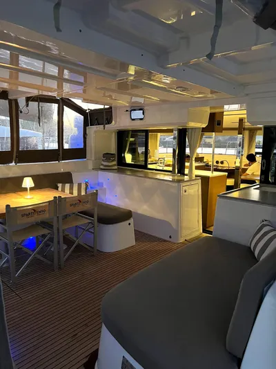 Martina Yacht Photos Pics Interior of 2021 Lagoon 46 catamaran with modern seating and dining area.