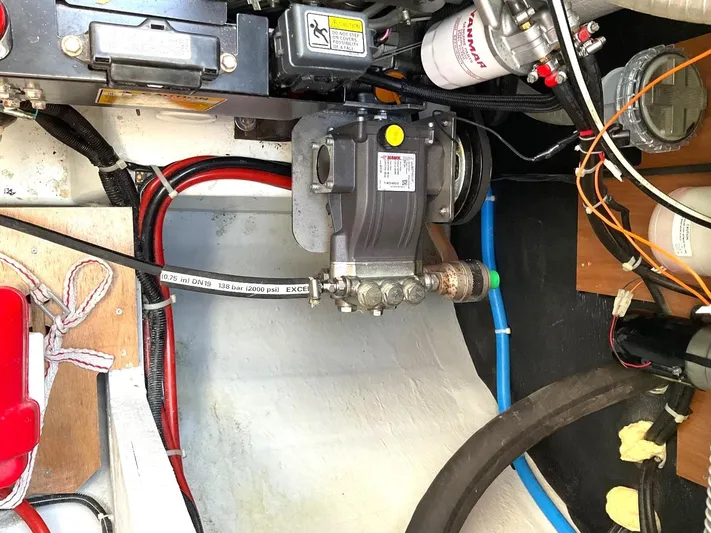 Martina Yacht Photos Pics Engine compartment of a 2021 Lagoon 46 catamaran, showcasing mechanical components and wiring.