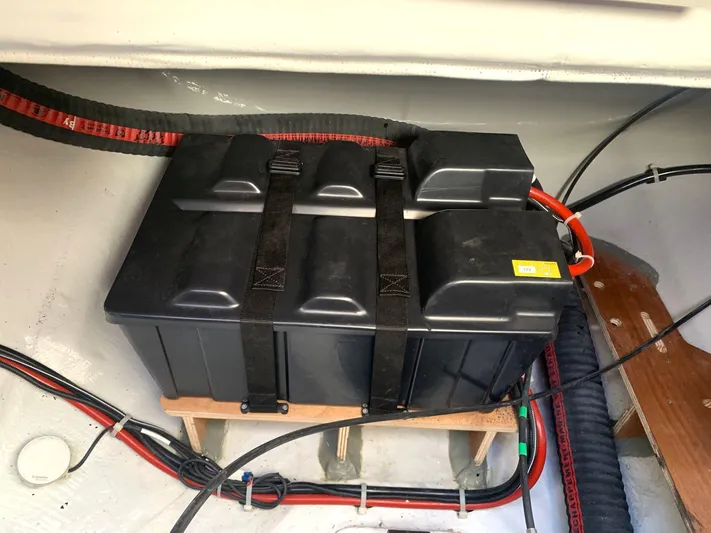 Martina Yacht Photos Pics Battery compartment in a 2021 Lagoon 46 catamaran with secured black battery box.