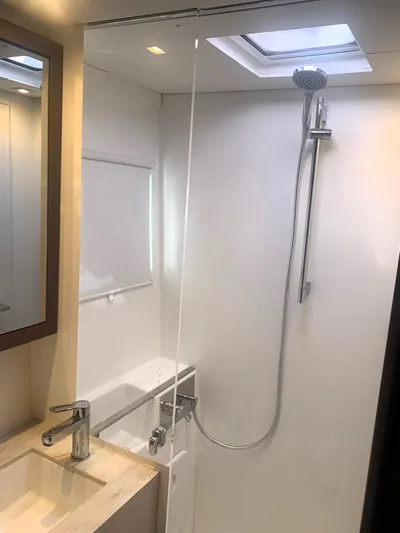 Martina Yacht Photos Pics Modern bathroom in 2021 Lagoon 46 yacht with sleek shower and skylight.