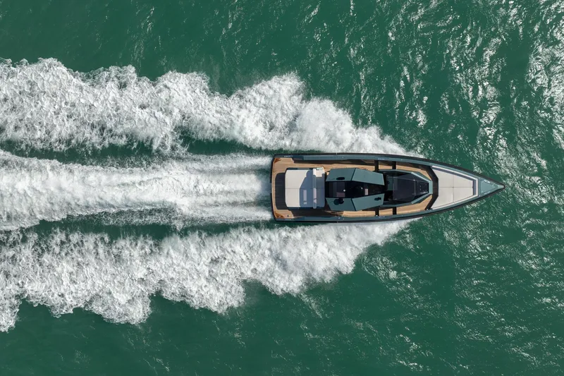 Wally Yacht Photos Pics Aerial view of 2021 Wally 48 Wally Tender cruising on turquoise water.