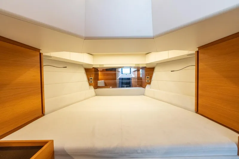 Wally Yacht Photos Pics 2021 Wally 48 Wally Tender interior cabin with modern wood and white design.