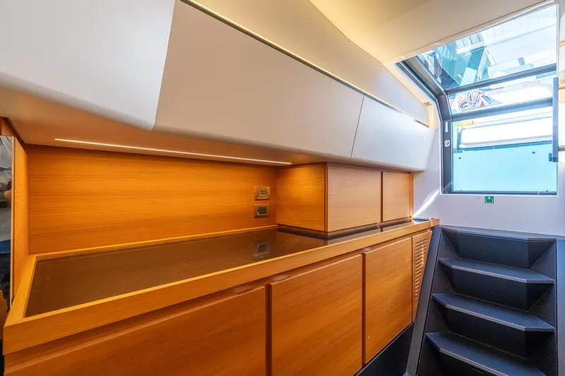 Wally Yacht Photos Pics Interior of 2021 Wally 48 Wally Tender yacht with modern wood cabinetry and stairs.