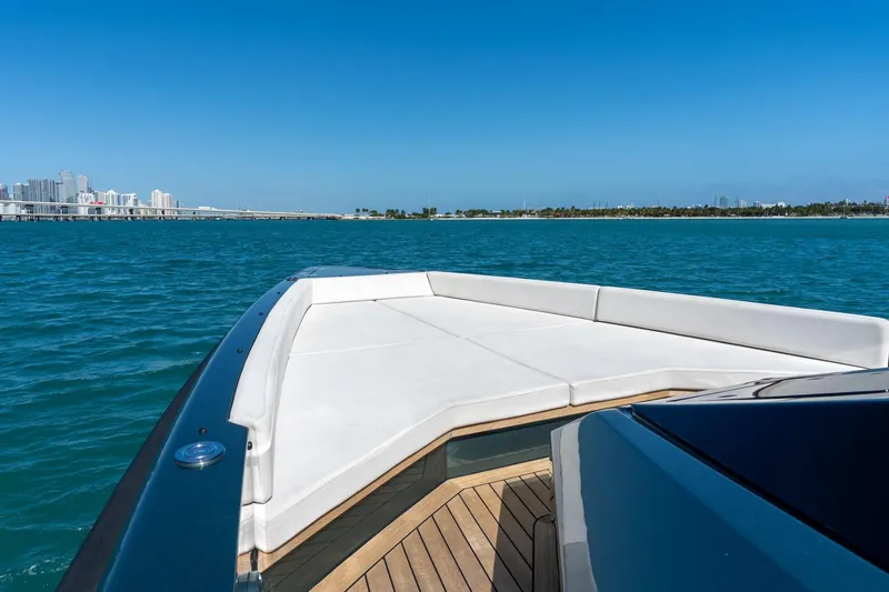 Wally Yacht Photos Pics 2021 Wally 48 Wally Tender yacht cruising on blue ocean near city skyline.