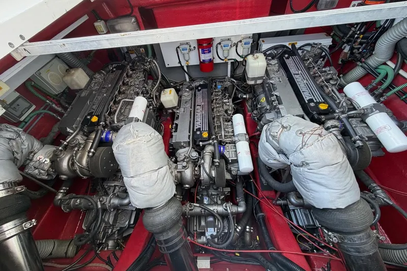  Yacht Photos Pics Engine room of a 2004 Sunseeker Superhawk 50, showcasing three powerful engines.