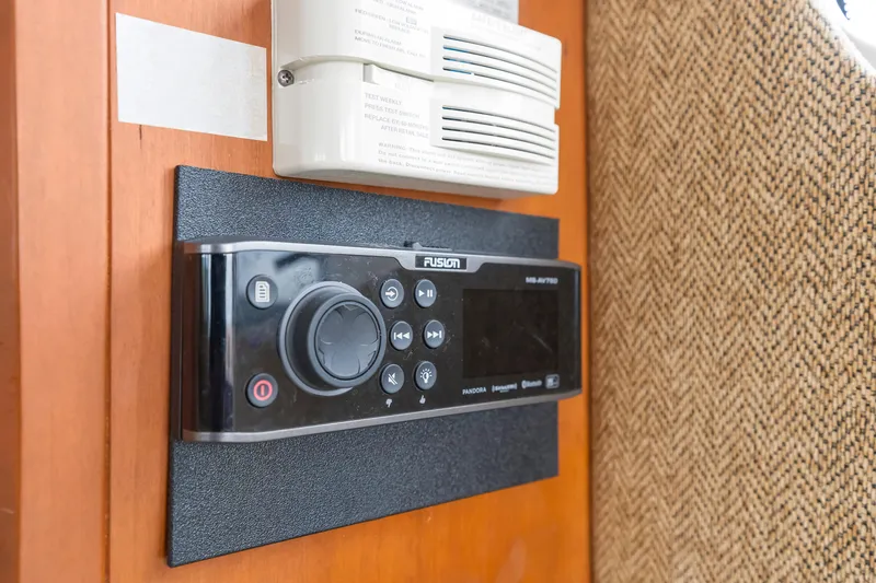 Water Cave Yacht Photos Pics Fusion stereo system and smoke detector on 2005 Silverton 34 Convertible yacht interior.