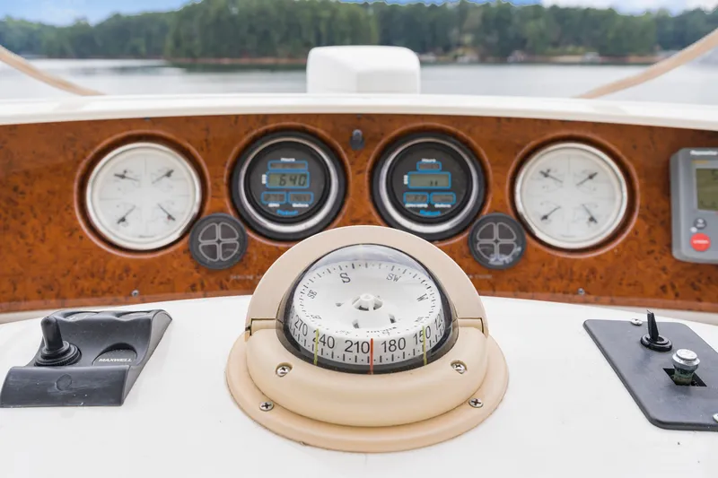Water Cave Yacht Photos Pics Dashboard of a 2005 Silverton 34 Convertible boat with compass and gauges.