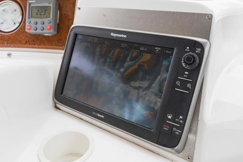 Water Cave Yacht Photos Pics Raymarine navigation system on 2005 Silverton 34 Convertible boat dashboard.