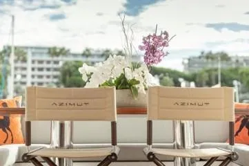  Yacht Photos Pics Azimut Fly 72 yacht deck with chairs and floral arrangement, 2020 model.