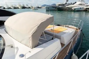  Yacht Photos Pics 2020 Azimut Fly 72 yacht docked in marina, featuring sun deck and canopy.