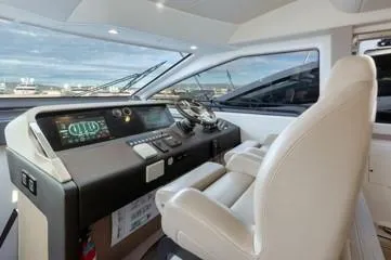  Yacht Photos Pics 2020 Azimut Fly 72 yacht helm with modern controls and luxurious seating.
