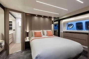  Yacht Photos Pics Luxurious bedroom interior of 2020 Azimut Fly 72 yacht with modern design and elegant furnishings.
