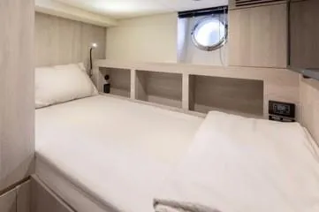  Yacht Photos Pics Luxurious cabin interior of 2020 Azimut Fly 72 yacht with modern design and cozy bedding.