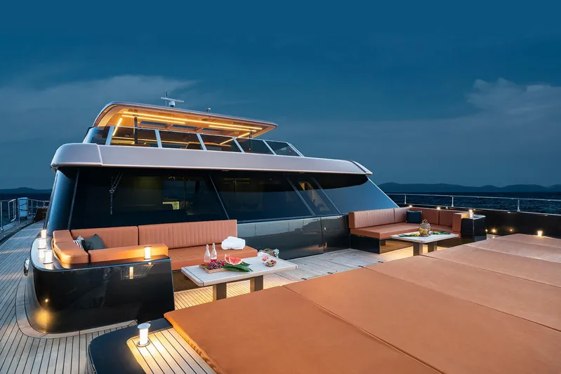  Yacht Photos Pics Luxurious 2026 Sunreef 100 Power yacht with elegant deck seating at sunset.