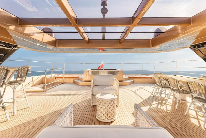  Yacht Photos Pics Luxurious deck of 2026 Sunreef 100 Sunreef Power yacht with elegant seating and ocean view.