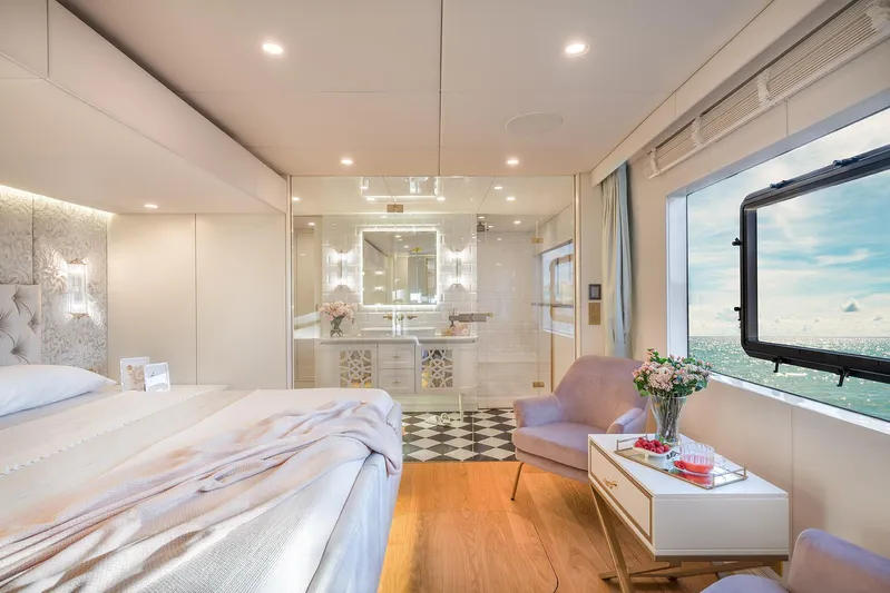  Yacht Photos Pics Luxurious bedroom interior of 2026 Sunreef 100 Power yacht with ocean view.