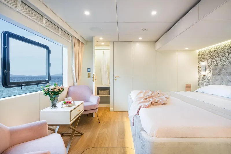  Yacht Photos Pics Luxurious cabin interior of 2026 Sunreef 100 Sunreef Power yacht with ocean view.