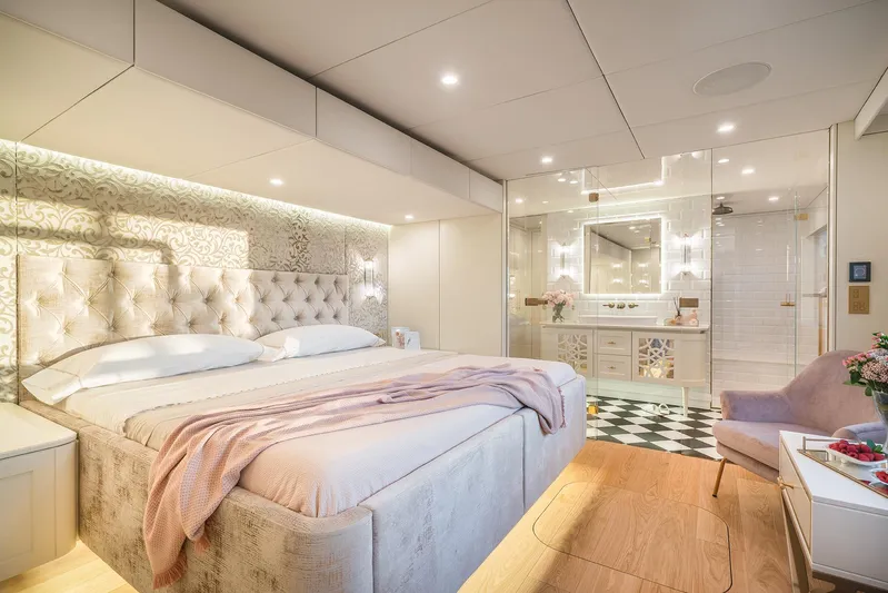 Yacht Photos Pics Luxurious bedroom interior on 2026 Sunreef 100 Power yacht, featuring elegant decor and modern amenities.