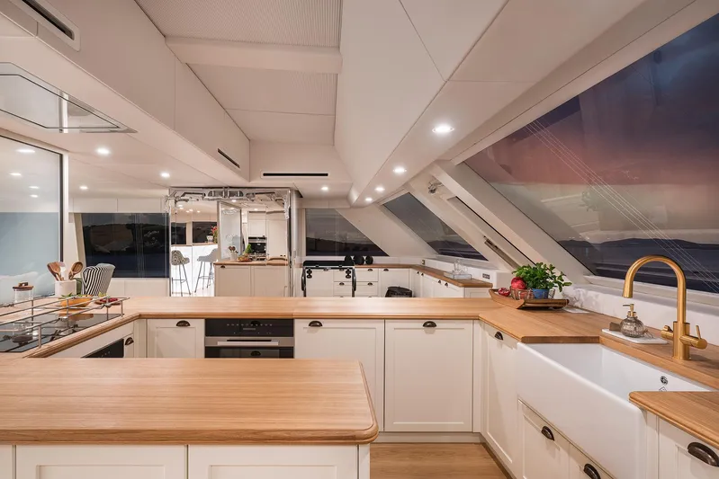  Yacht Photos Pics Luxurious kitchen interior of 2026 Sunreef 100 Sunreef Power yacht with modern design and ocean view.