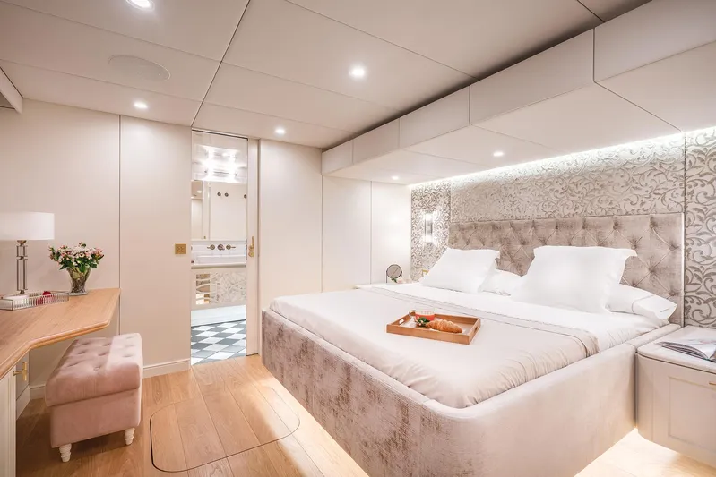  Yacht Photos Pics Luxurious bedroom interior of 2026 Sunreef 100 Sunreef Power yacht, featuring elegant decor and plush bedding.