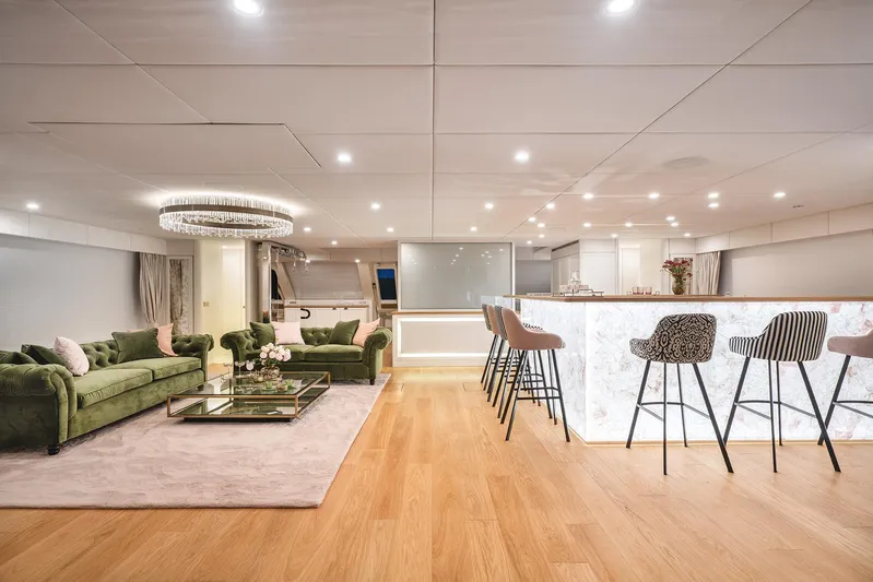  Yacht Photos Pics Luxurious interior of 2026 Sunreef 100 Power yacht with elegant seating and modern bar area.