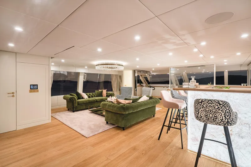  Yacht Photos Pics Luxurious interior of 2026 Sunreef 100 Power yacht with elegant seating and modern bar area.