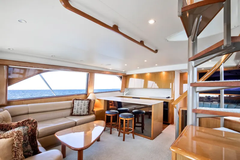 Good To Go Yacht Photos Pics Luxurious interior of 2002 Viking 61 yacht with elegant seating and modern kitchen area.