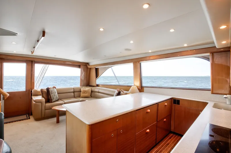 Good To Go Yacht Photos Pics Luxurious interior of 2002 Viking 61 yacht with ocean view and elegant furnishings.