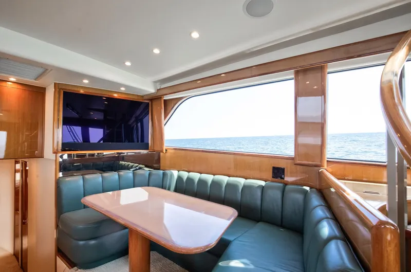 Good To Go Yacht Photos Pics Luxurious interior of a 2002 Viking 61 yacht with ocean view and plush seating.