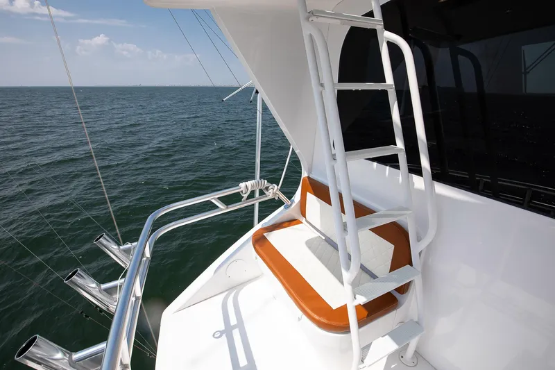 Good To Go Yacht Photos Pics 2002 Viking 61 yacht deck with ladder and ocean view.