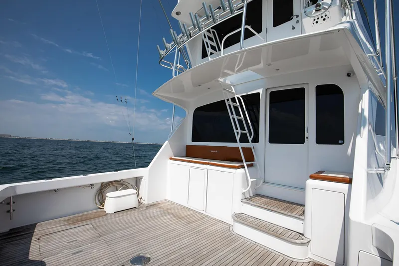 Good To Go Yacht Photos Pics 2002 Viking 61 yacht deck with stairs, ocean view, and clear sky.