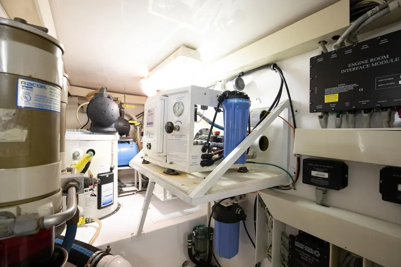 Good To Go Yacht Photos Pics Engine room of 2002 Viking 61 yacht with filtration and control systems.