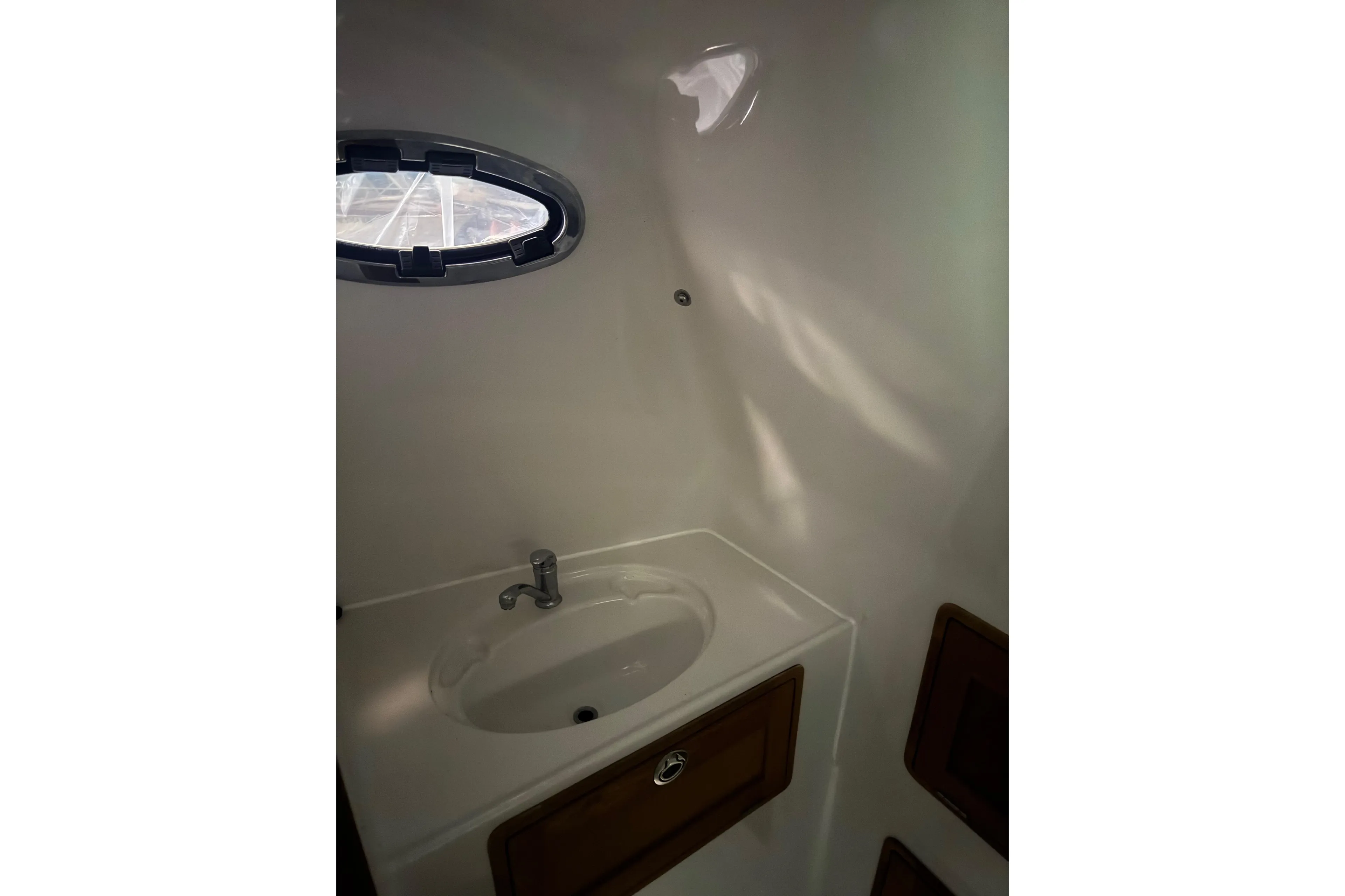 Compact bathroom sink in 2016 Protector Tauranga 41 boat interior.