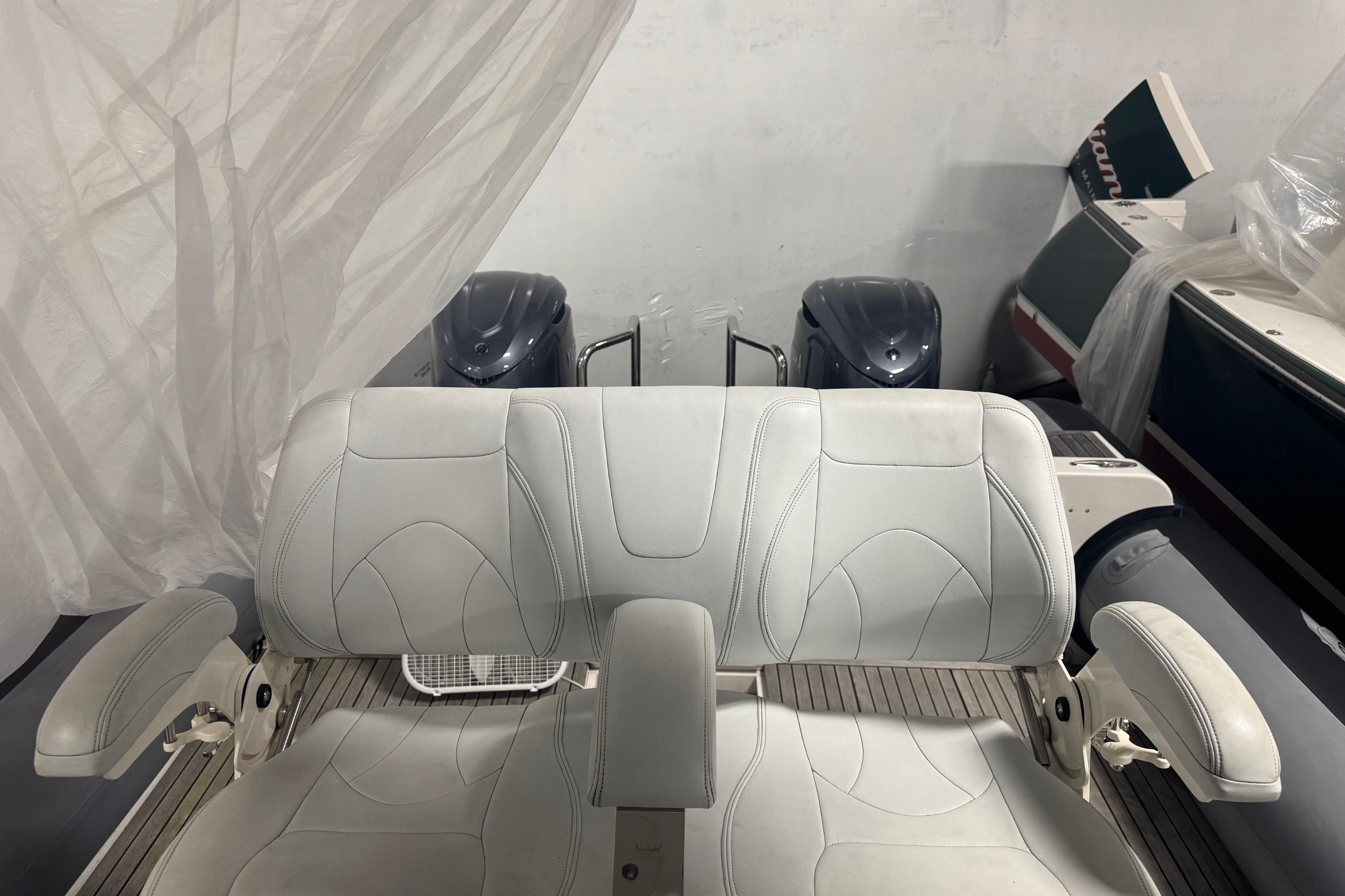 White leather boat seating on a 2016 Protector Tauranga 41, with engines in the background.
