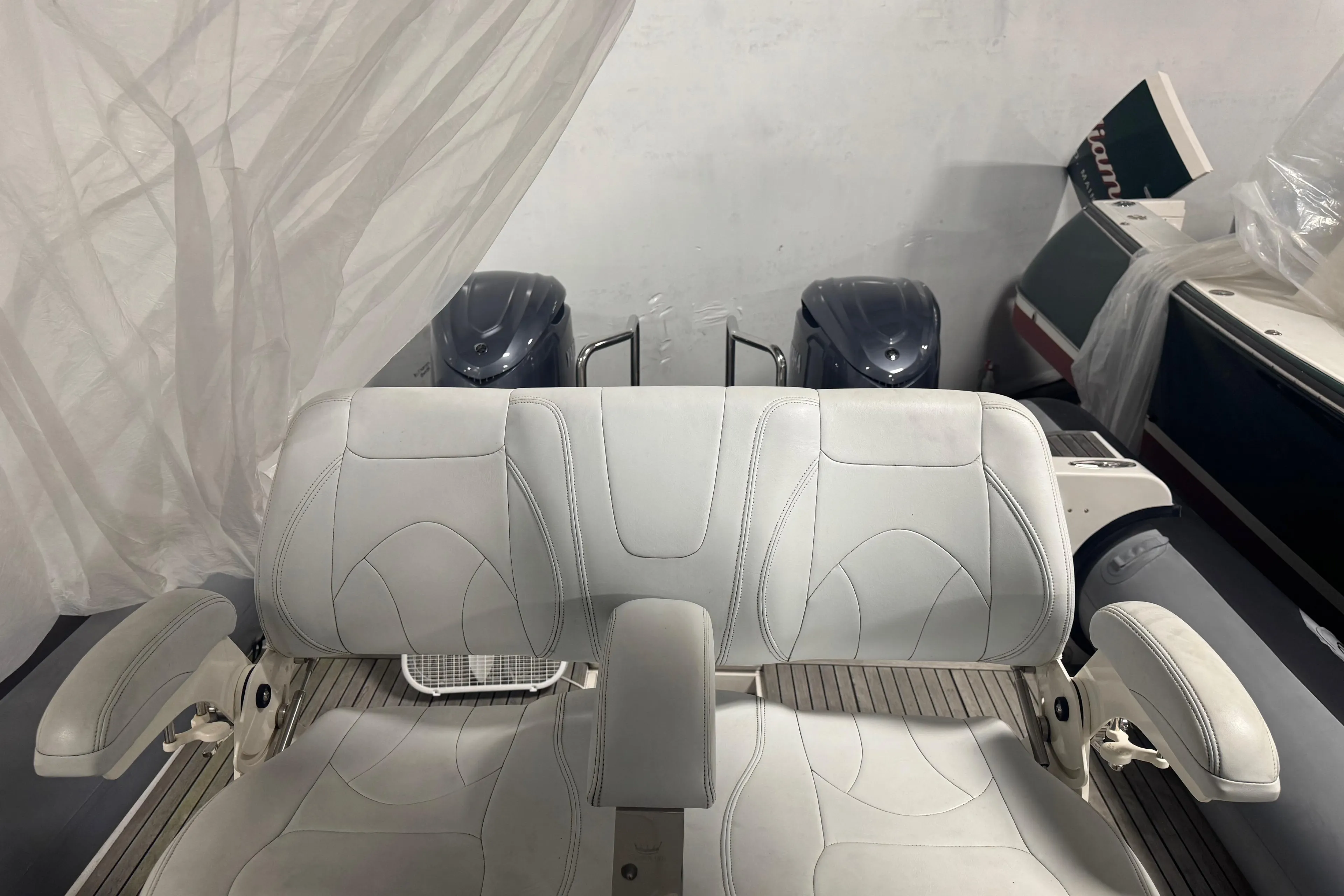 White leather boat seating on a 2016 Protector Tauranga 41, with engines in the background.