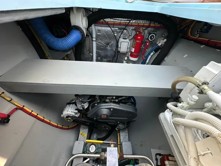 Starship Yacht Photos Pics Engine room of 2017 Gunboat 55 yacht, featuring mechanical components and fire safety equipment.