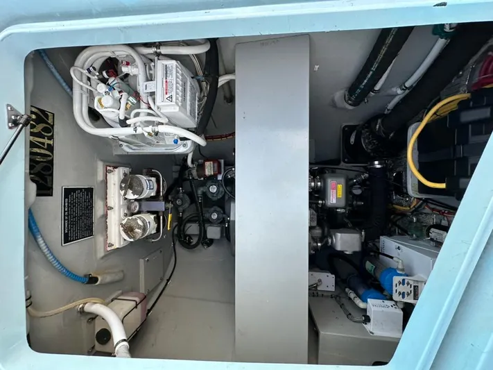 Starship Yacht Photos Pics Engine compartment of a 2017 Gunboat 55, showcasing mechanical components and wiring.