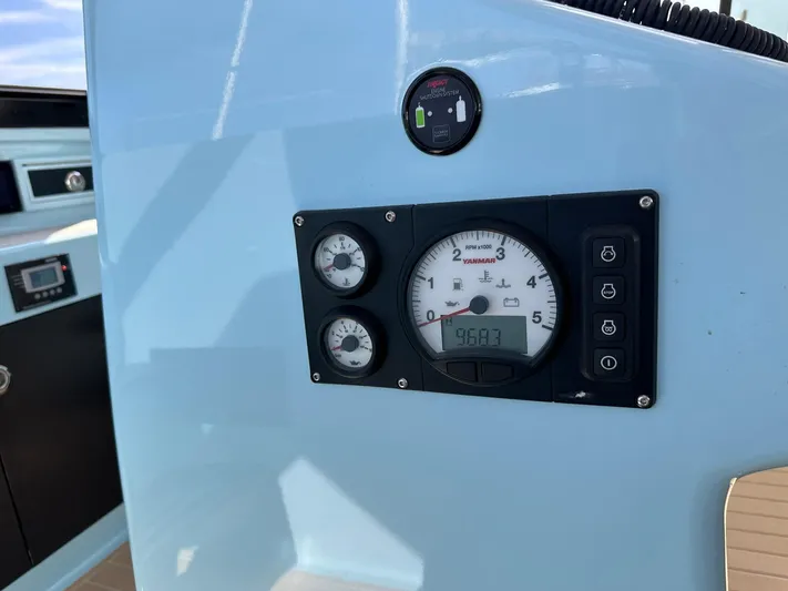 Starship Yacht Photos Pics Control panel of a 2017 Gunboat 55 yacht, featuring gauges and digital display.