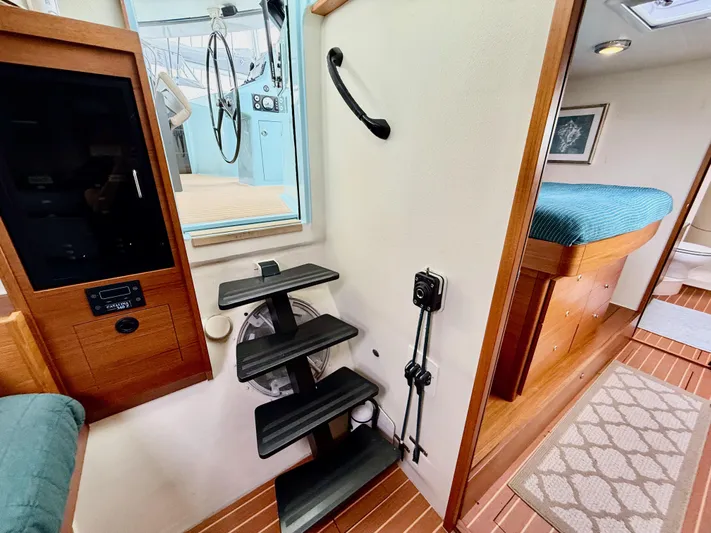 Starship Yacht Photos Pics Interior of 2017 Gunboat 55 yacht featuring stairs and cozy cabin area.