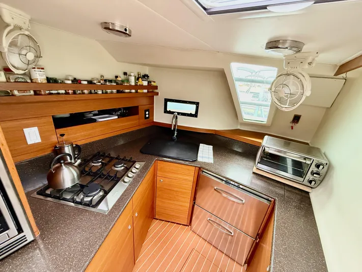 Starship Yacht Photos Pics Modern kitchen in 2017 Gunboat 55 yacht with stove, sink, and oven.