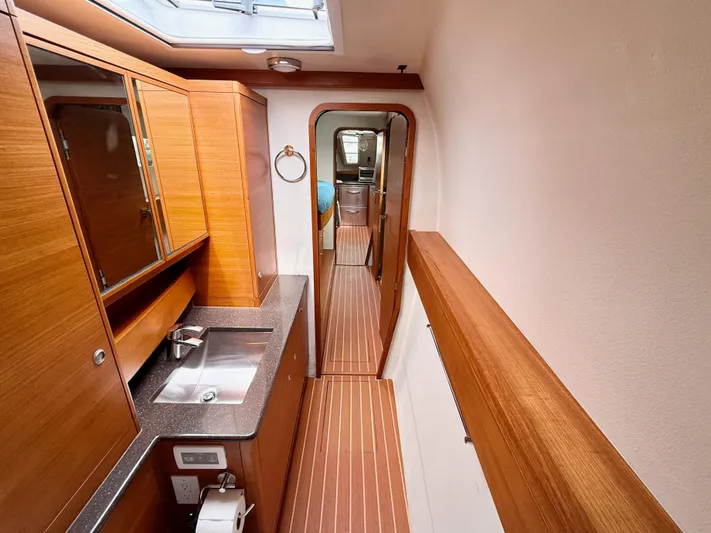 Starship Yacht Photos Pics Luxurious interior of 2017 Gunboat 55 yacht with wood finishes and modern amenities.