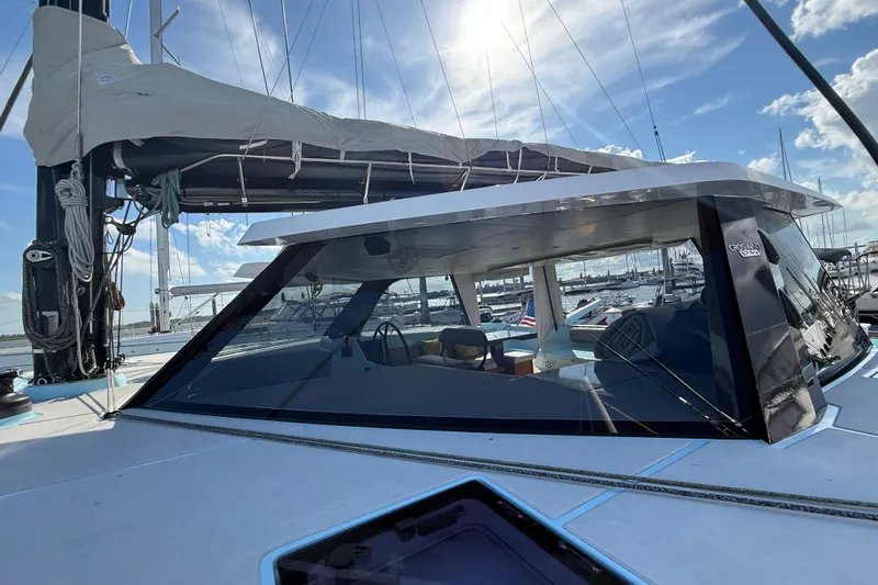 Starship Yacht Photos Pics 2017 Gunboat 55 yacht with sleek design, docked under a sunny sky.