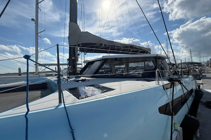 Starship Yacht Photos Pics 2017 Gunboat 55 yacht docked under a bright, sunny sky.
