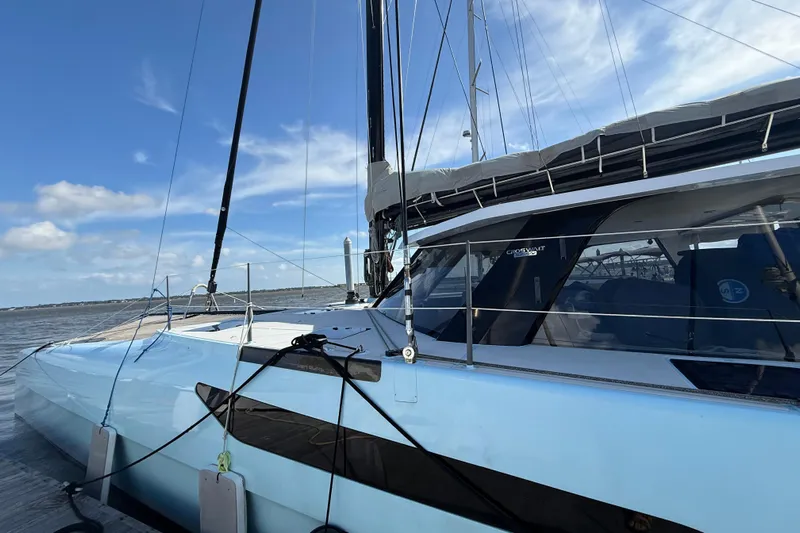 Starship Yacht Photos Pics 2017 Gunboat 55 catamaran sailing on a sunny day with clear skies.