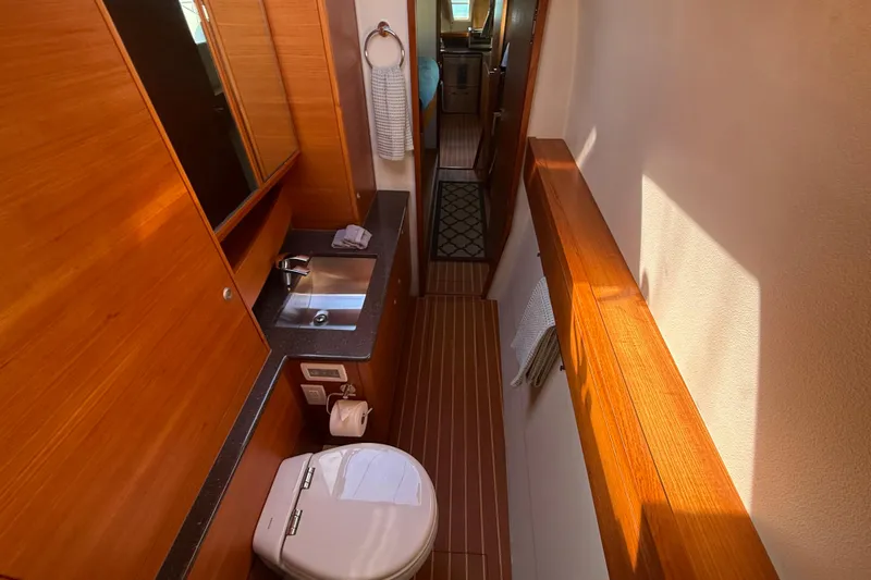 Starship Yacht Photos Pics Luxurious 2017 Gunboat 55 yacht bathroom with wooden finishes and modern amenities.