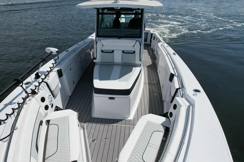  Yacht Photos Pics 2024 Blackfin 332 CC boat with spacious deck and seating on open water.