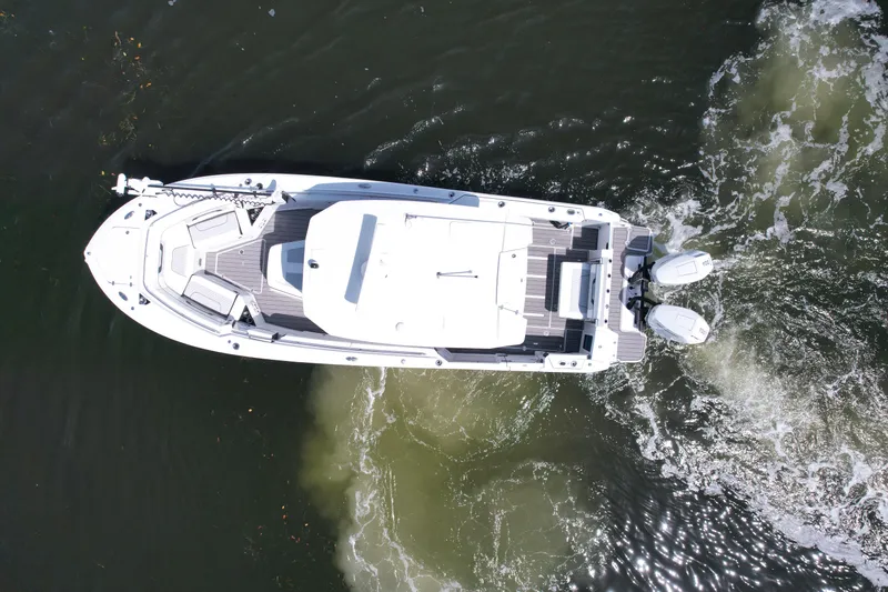  Yacht Photos Pics Aerial view of 2024 Blackfin 332 CC boat cruising on water.