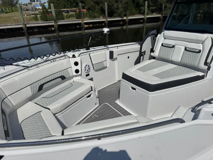  Yacht Photos Pics 2024 Blackfin 332 CC boat interior with luxurious seating and modern design.