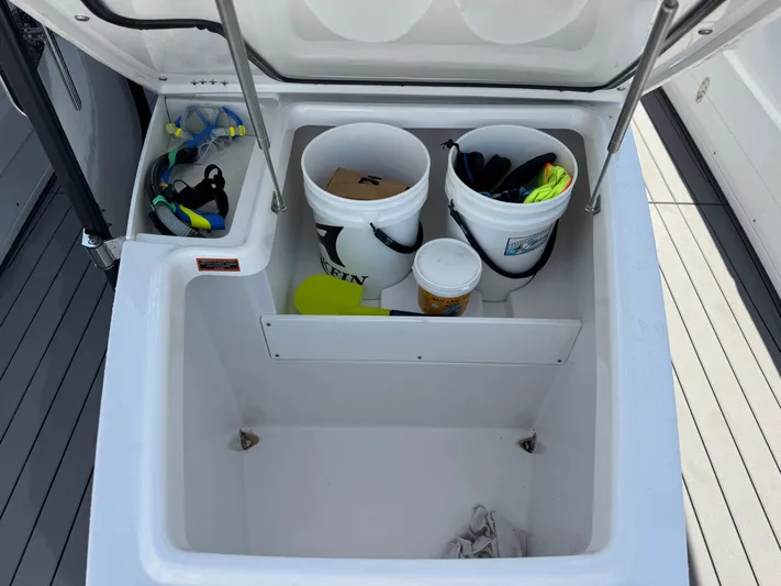  Yacht Photos Pics 2024 Blackfin 332 CC storage compartment with buckets and snorkeling gear.